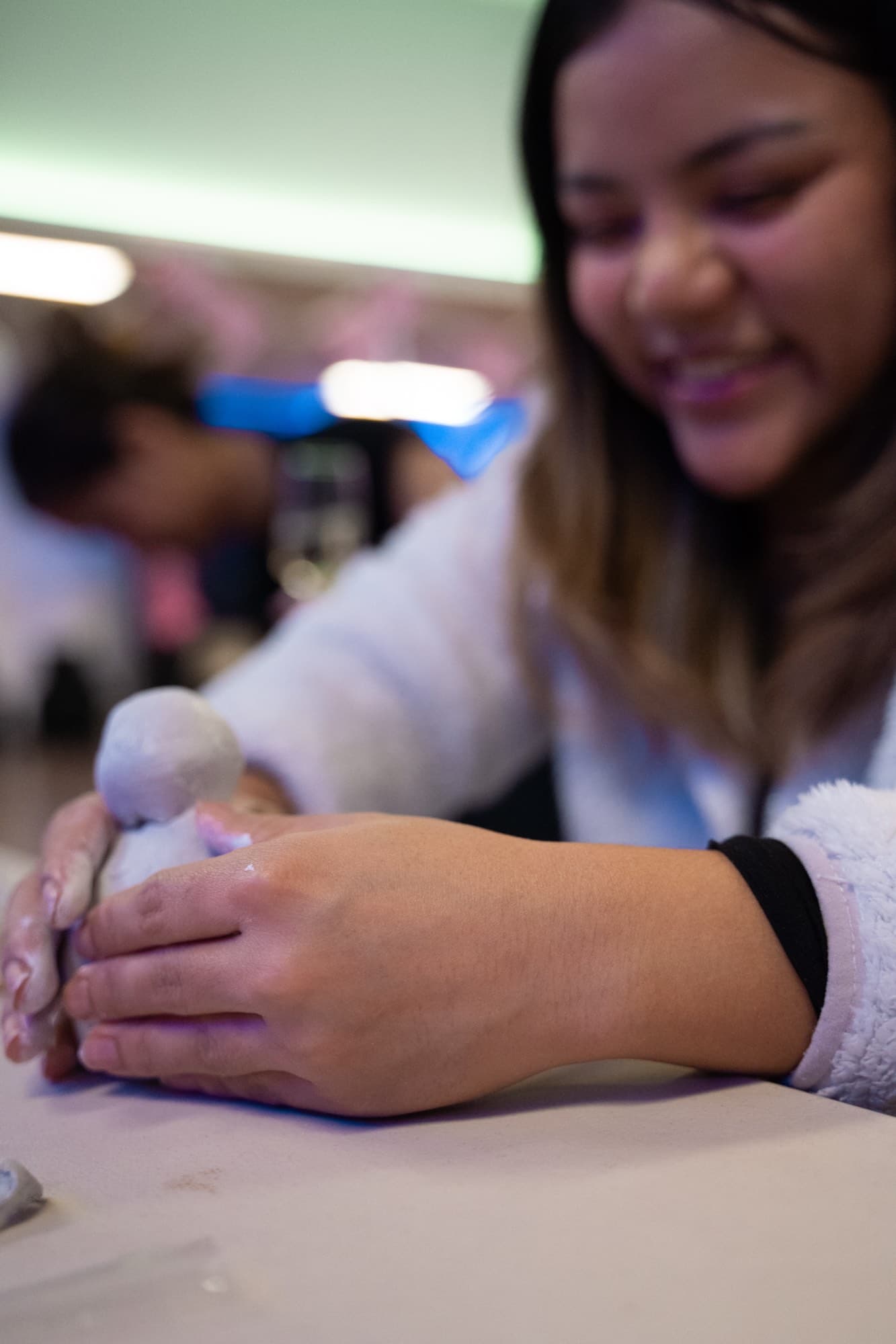 Guests laughing during the clay experience.