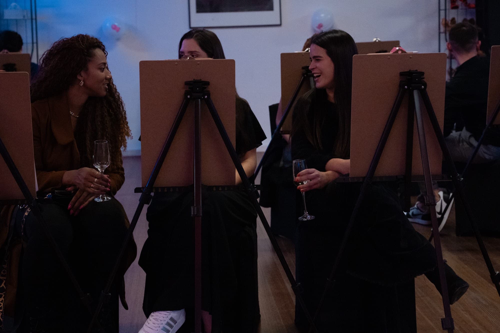 Guests drawing during a life drawing hens party.