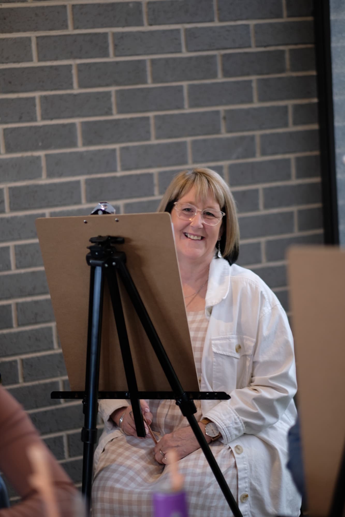 The model and guests during life drawing.