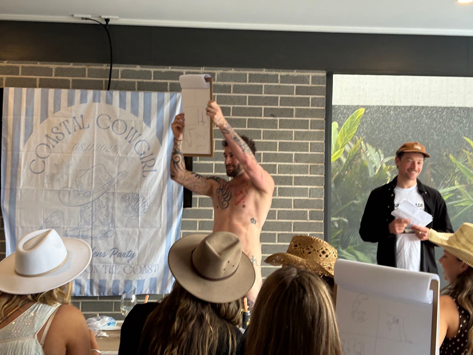 Guests enjoying a life drawing hens party.